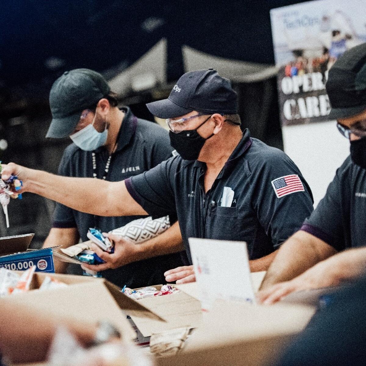 TechOps employee and veteran ships out 7,000th care package to military