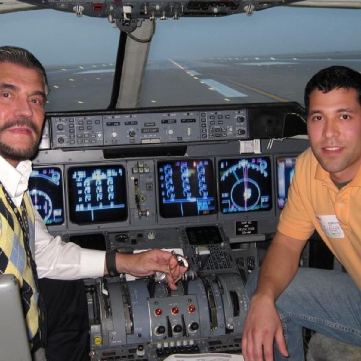 Mike Farinas and his father in the simulator together, pre-pandemic.