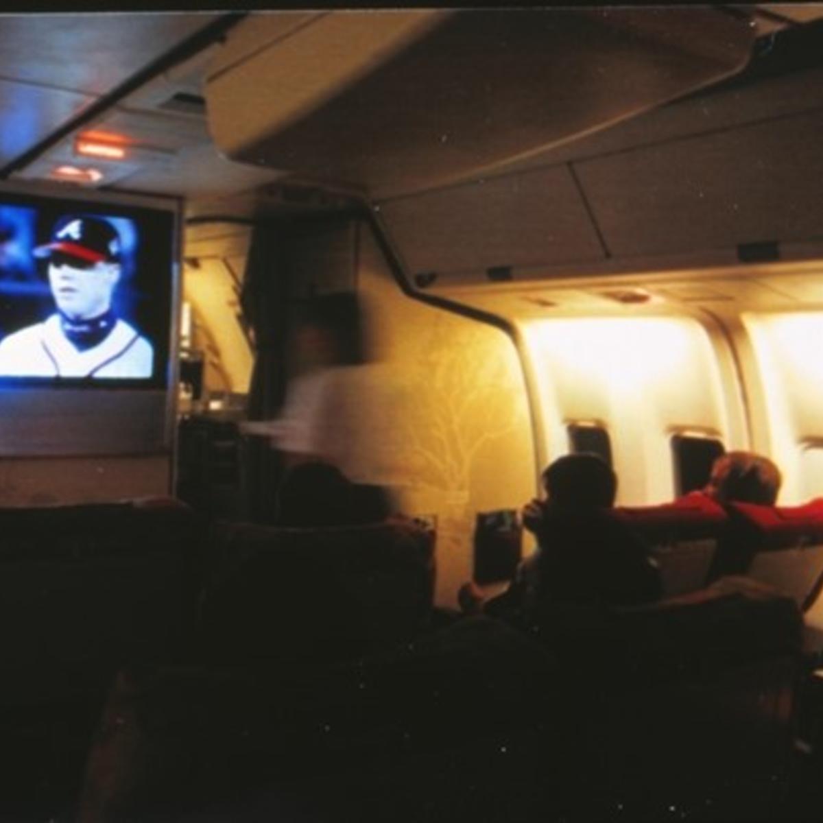 Passengers onboard Spirit of Delta watch a 1996 baseball postseason game featuring the Atlanta Braves live.