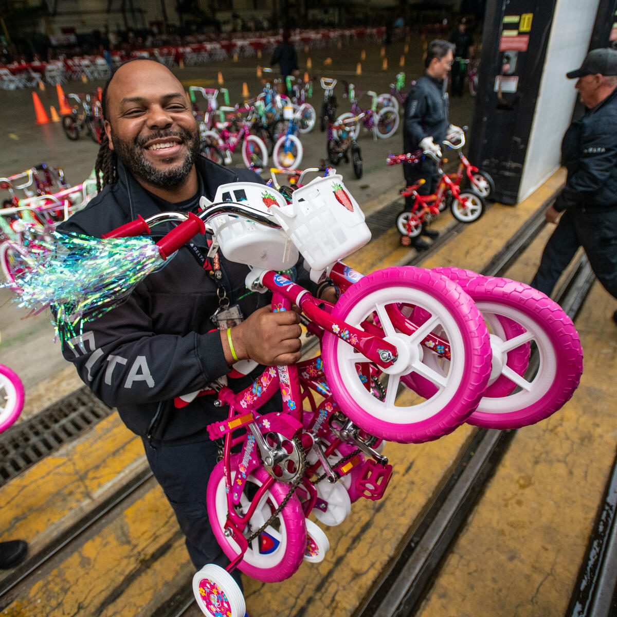Members of Delta's TechOps work to assemble bikes for Toys for Tots.