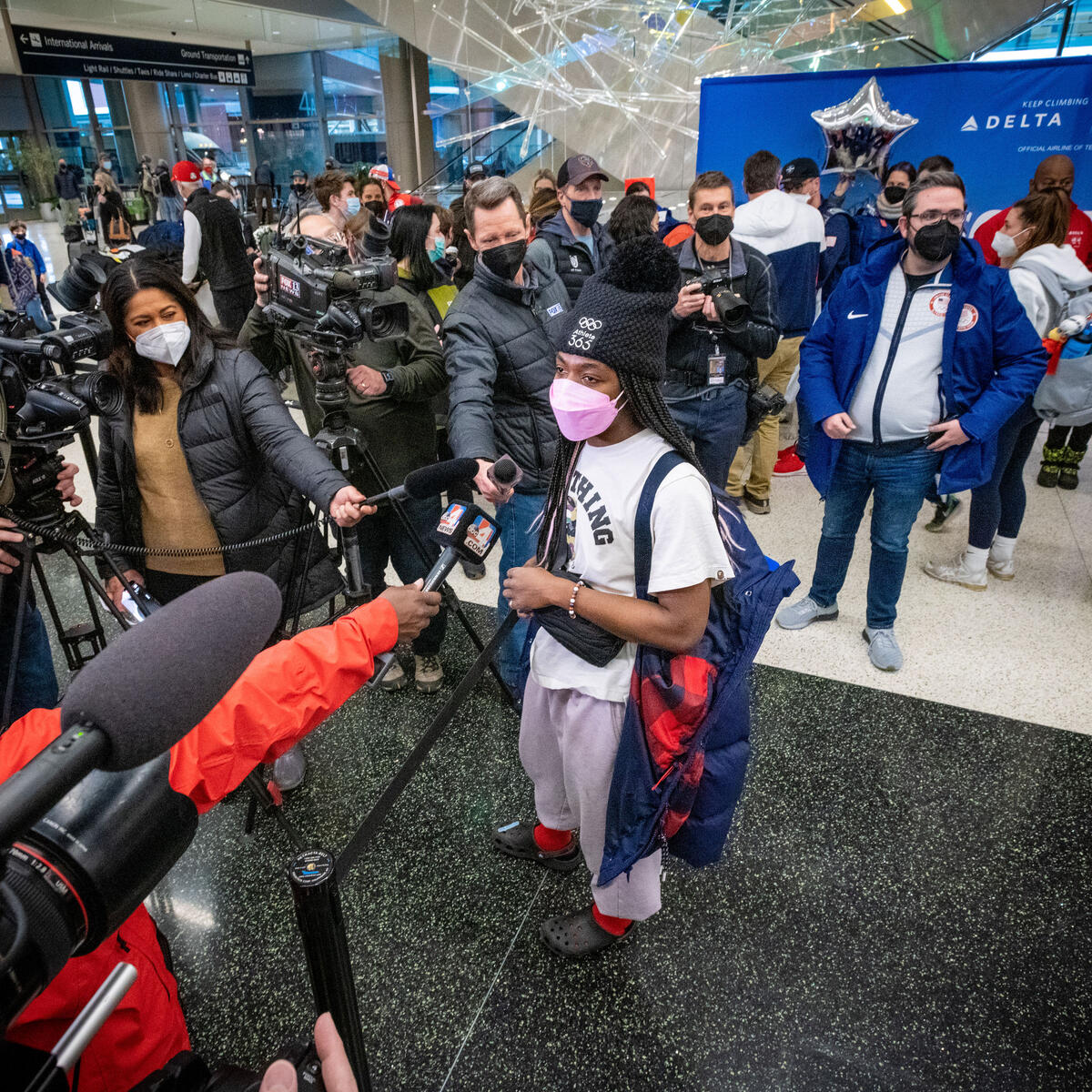 Maame Biney speaks with members of the media as Team USA athletes arrive at Salt Lake City International Airport in Salt Lake City, Utah on Monday, February 21, 2022.