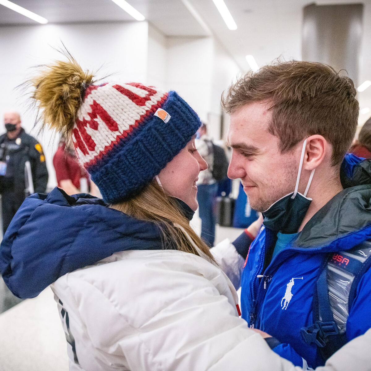 Ryan Pivirotto (right) and his fiancee, Nikki Leonard embrace as Team USA athletes arrive at Salt Lake City International Airport in Salt Lake City, Utah on Monday, February 21, 2022.
