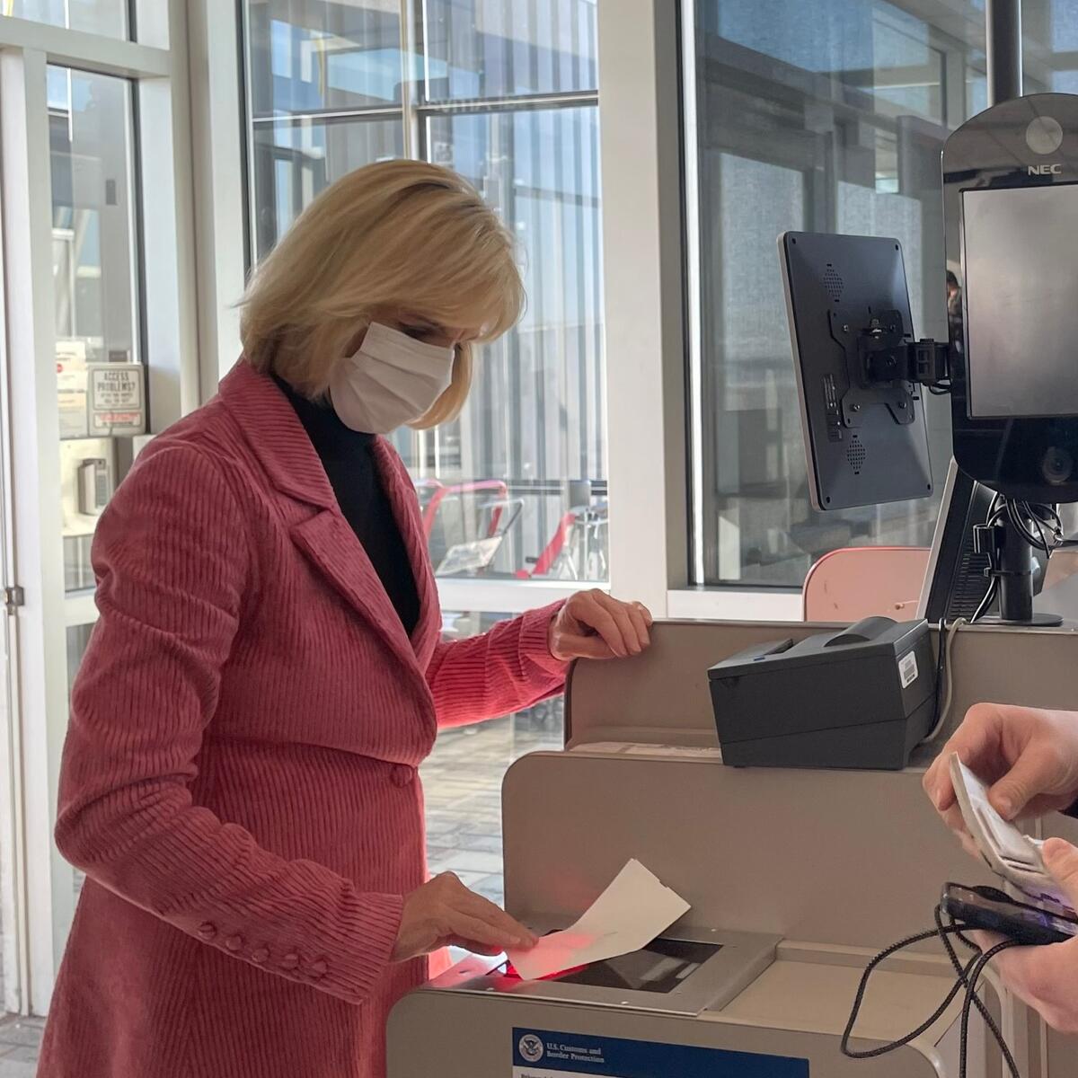 E.V.P. and Chief Customer Experience Officer Allison Ausband spends time scanning boarding passes at Delta's MSP hub.