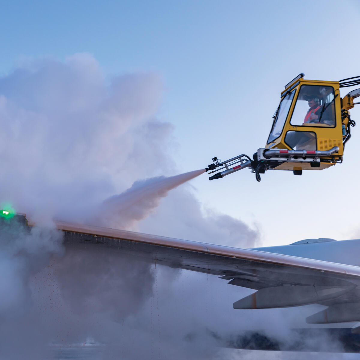 Deicing truck spraying down the wing of a Boeing 737-900ER