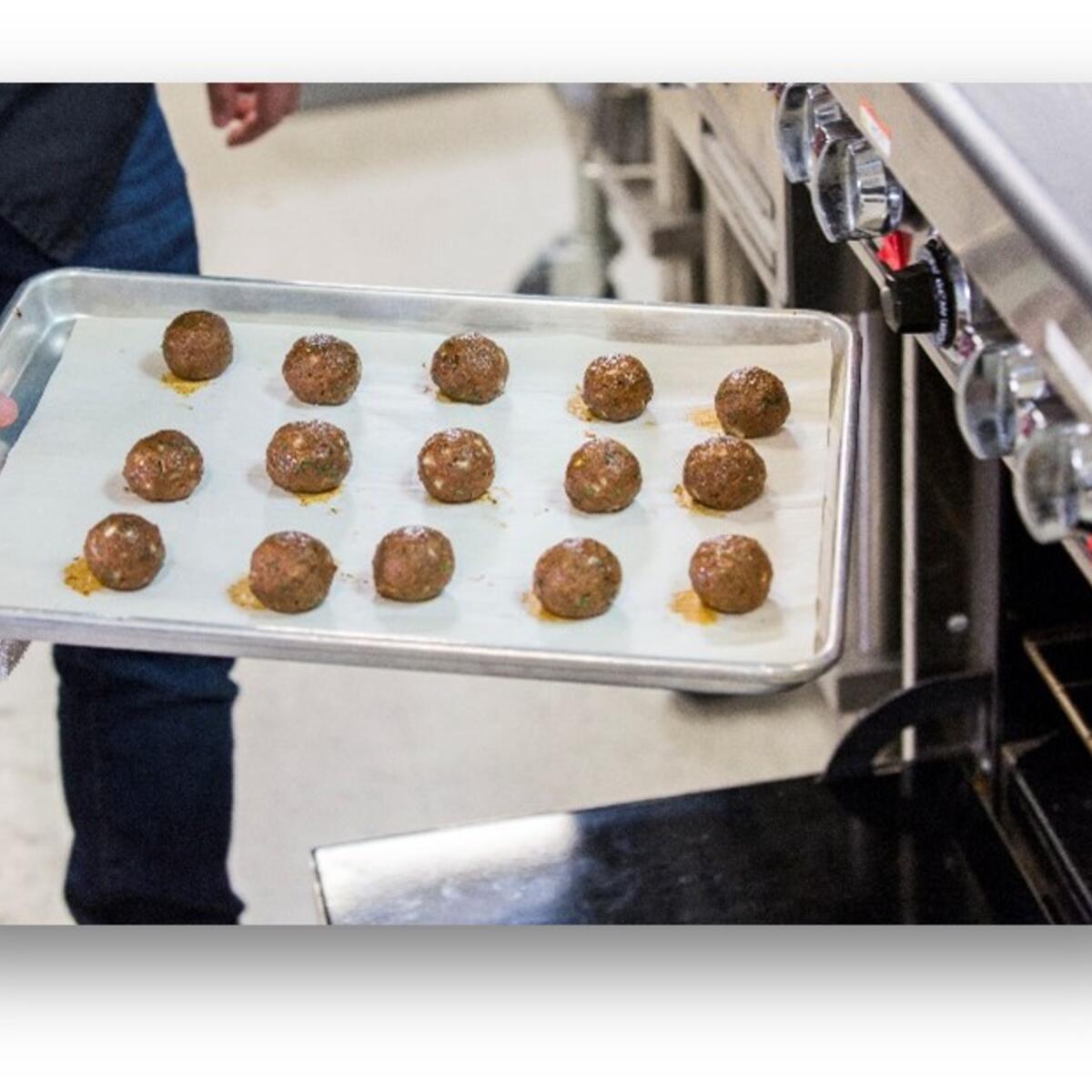 Photograph of Impossible Meatballs — a mix of Impossible Burger and Impossible™ Sausage and seasoned with a savory homestyle blend.