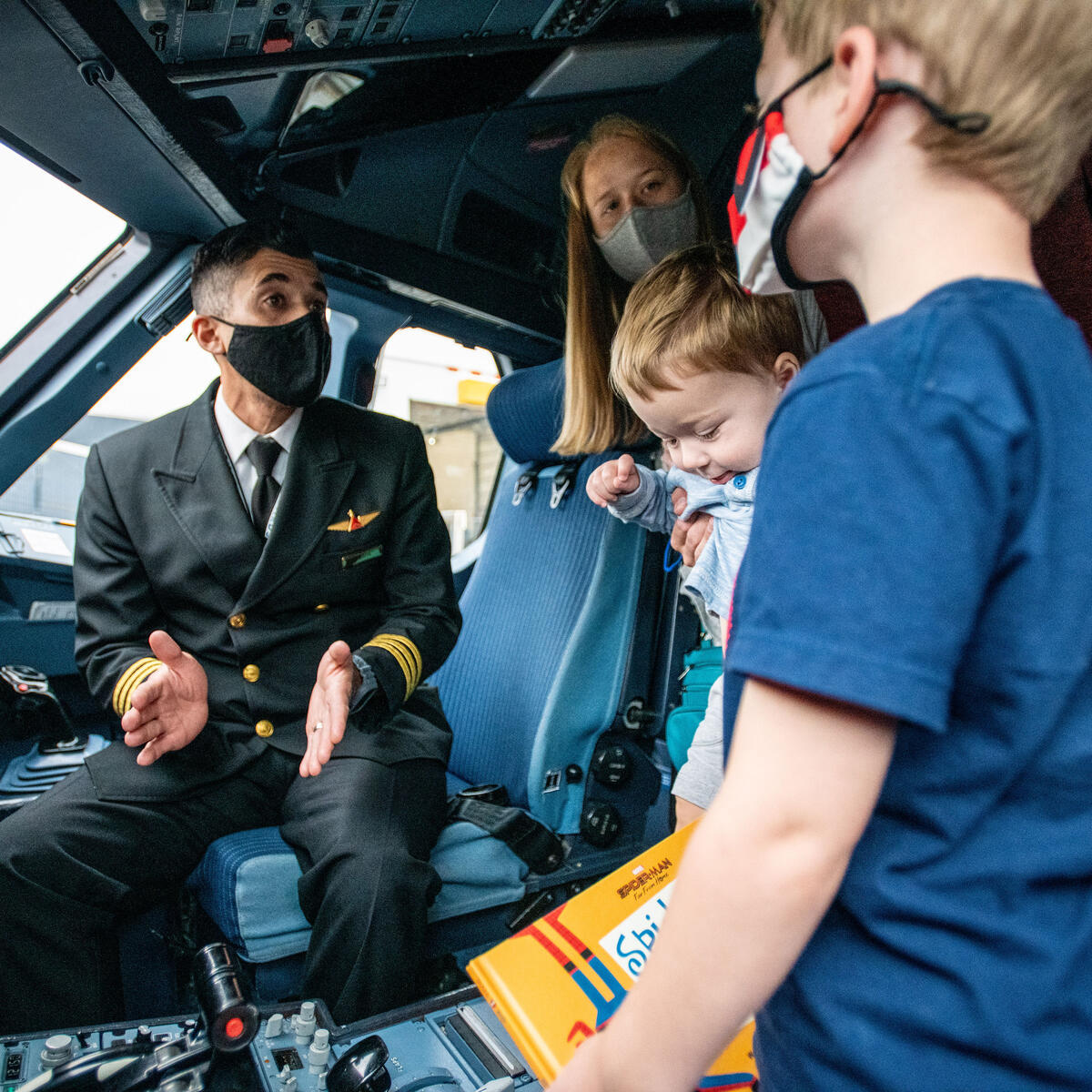 Customer and their children who participate in the Navigating MSP tour are able to explore different parts of the plane to feel comfortable with the fly process.