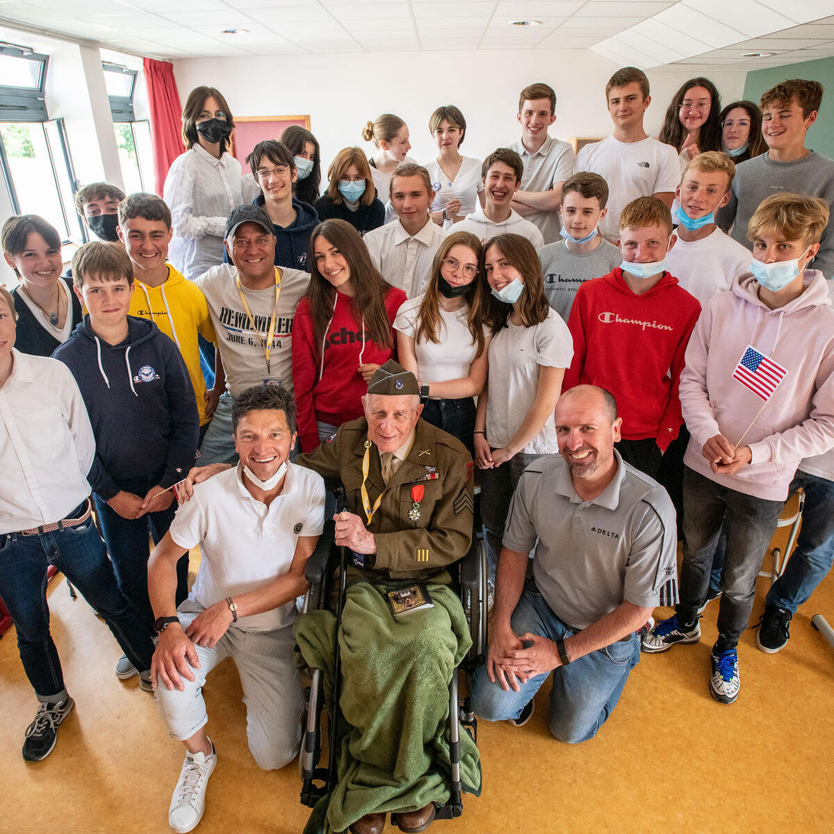 Delta’s Nick Scott with Bud Sabetay in the classroom during the Bayeux school visit.