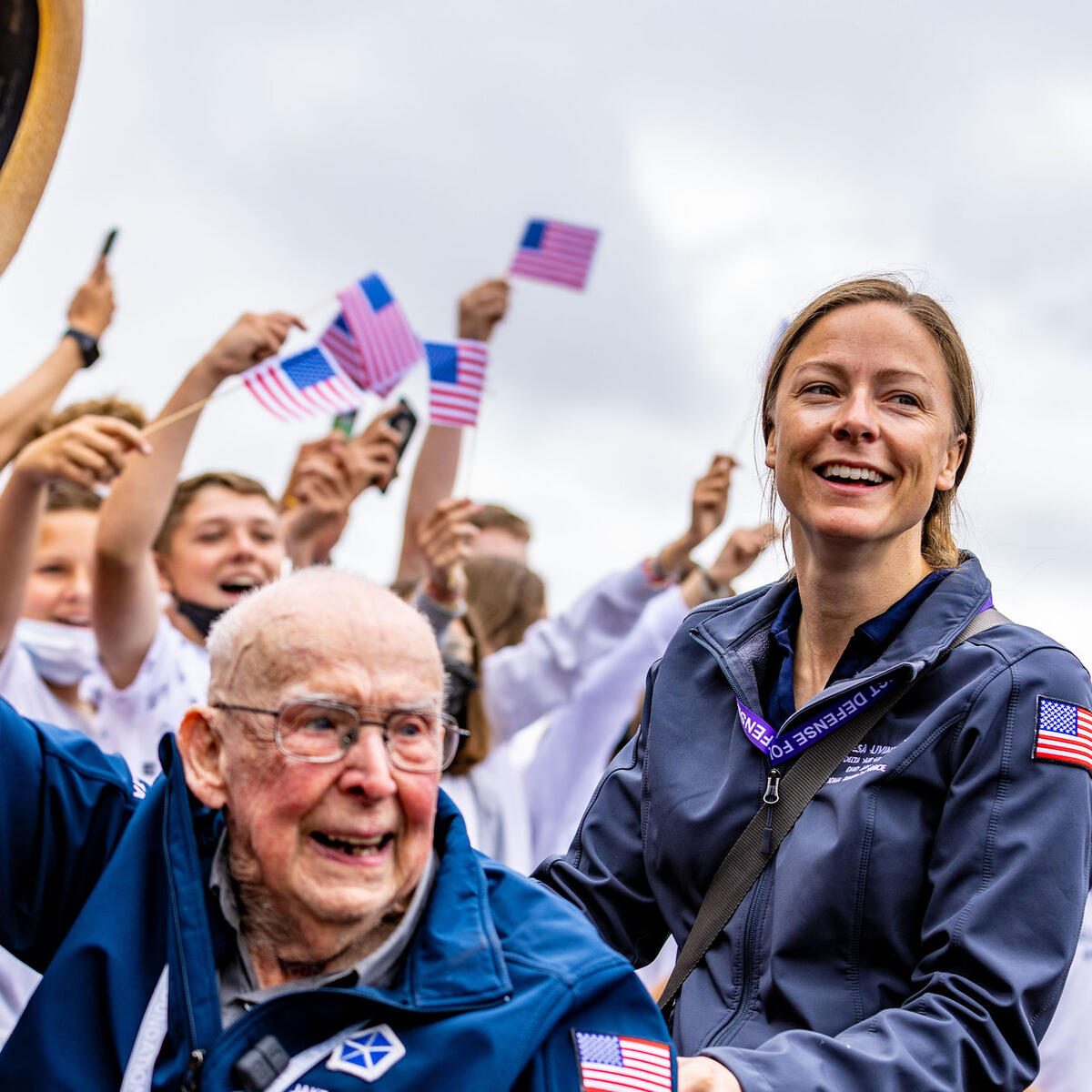 Delta’s Theresa Livingston escorts Jake Larson at a secondary school in Bayeux.