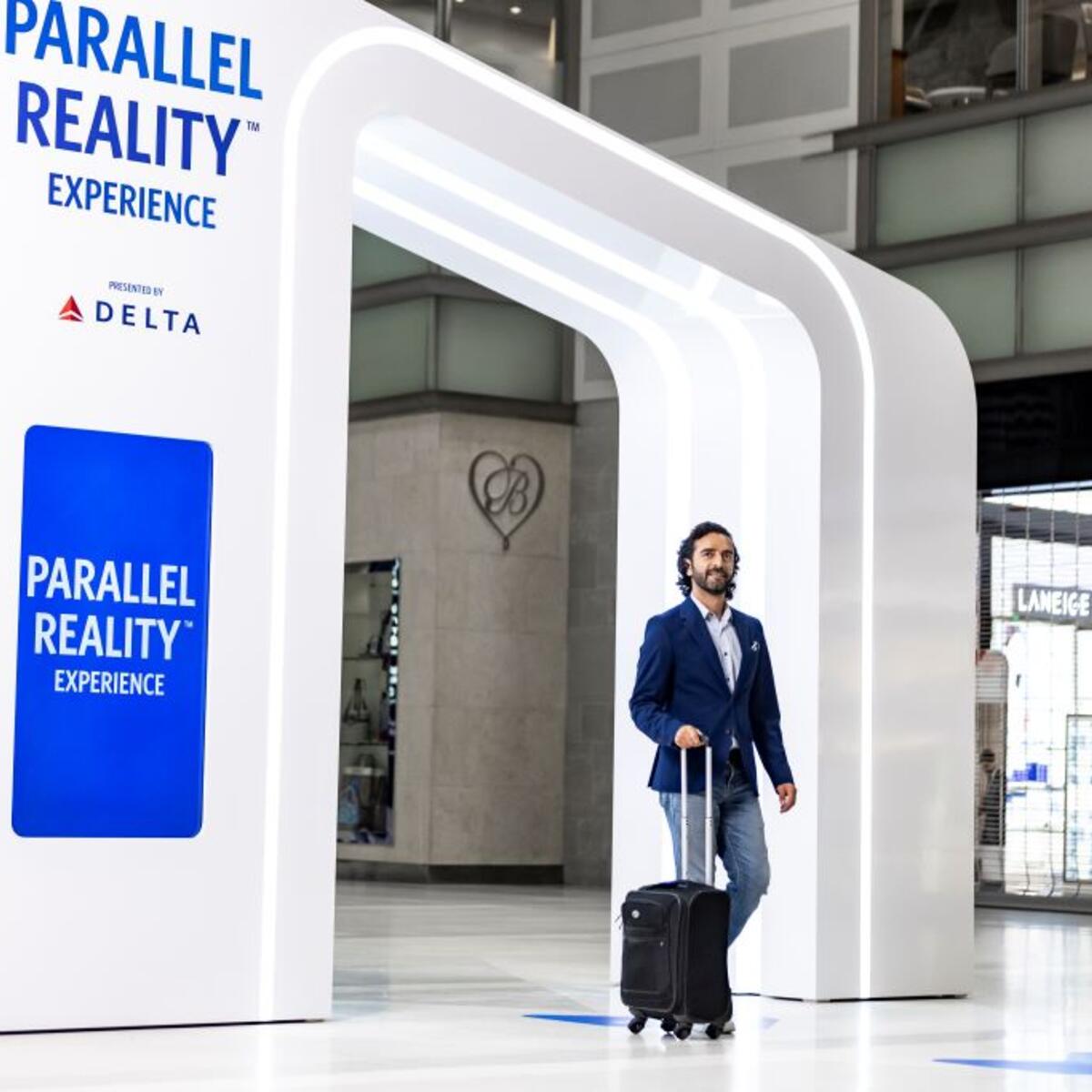 Delta customer entering the new PARALLEL REALITY experience at DTW.
