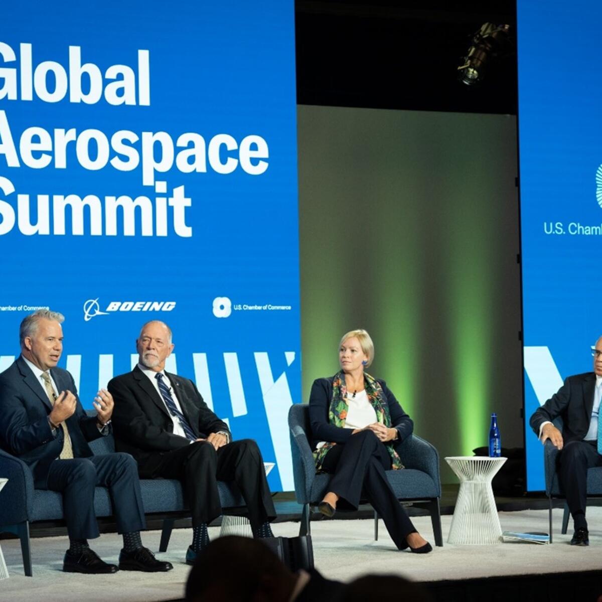 Capt. Patrick Burns (left) speaks on a panel at the U.S. Chamber of Commerce Global Aerospace Summit in September 2022.