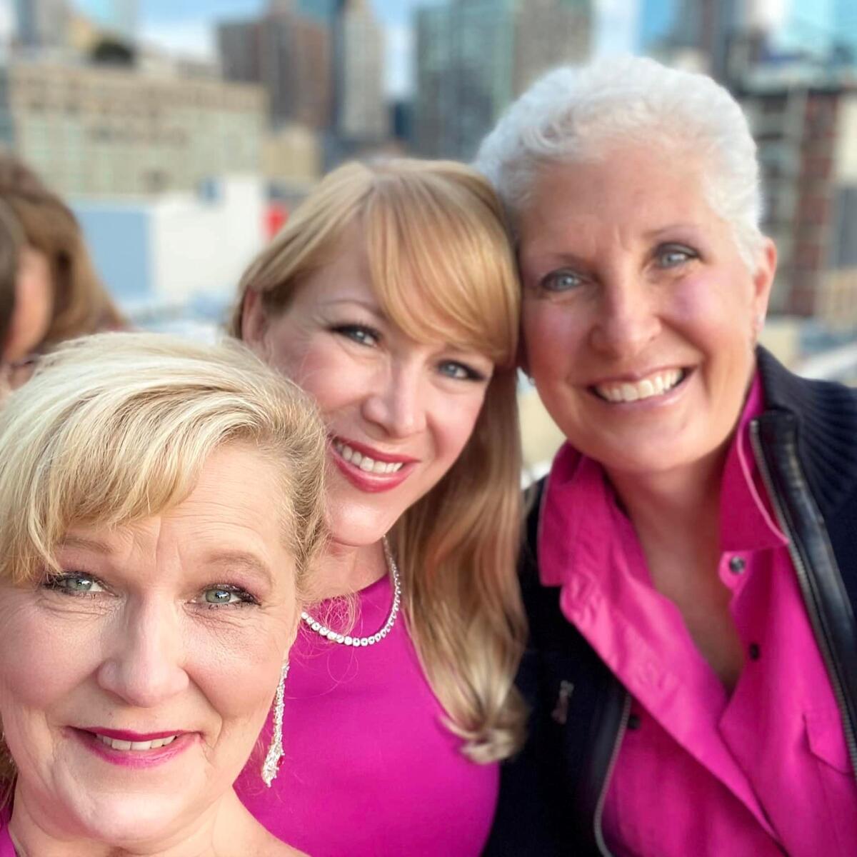 Flight attendant Linda Schlappy poses with Delta colleagues.