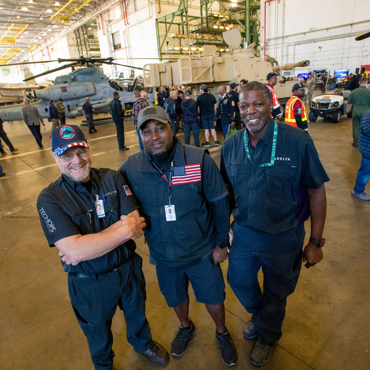 Three Delta TechOps employees pose for a photo at the airline's annual Veterans Day event on Nov. 4, 2022.