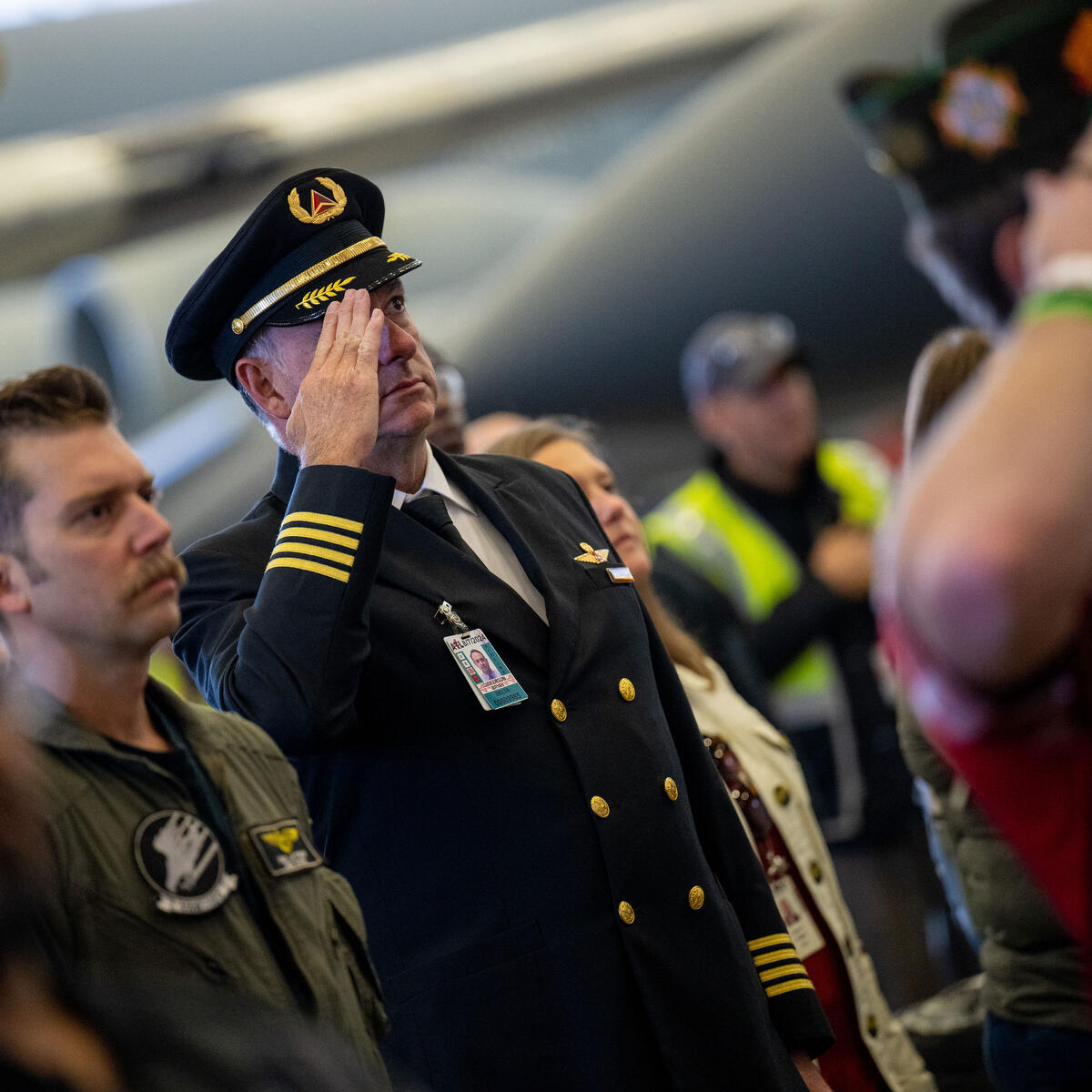 A Delta pilot salutes during the veterans appreciation event on Nov. 4, 2022.