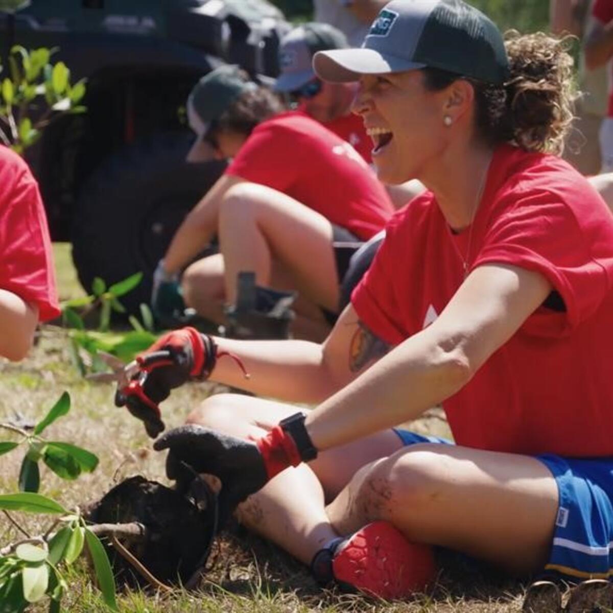 Delta employees participate in a tree planting in 2022.