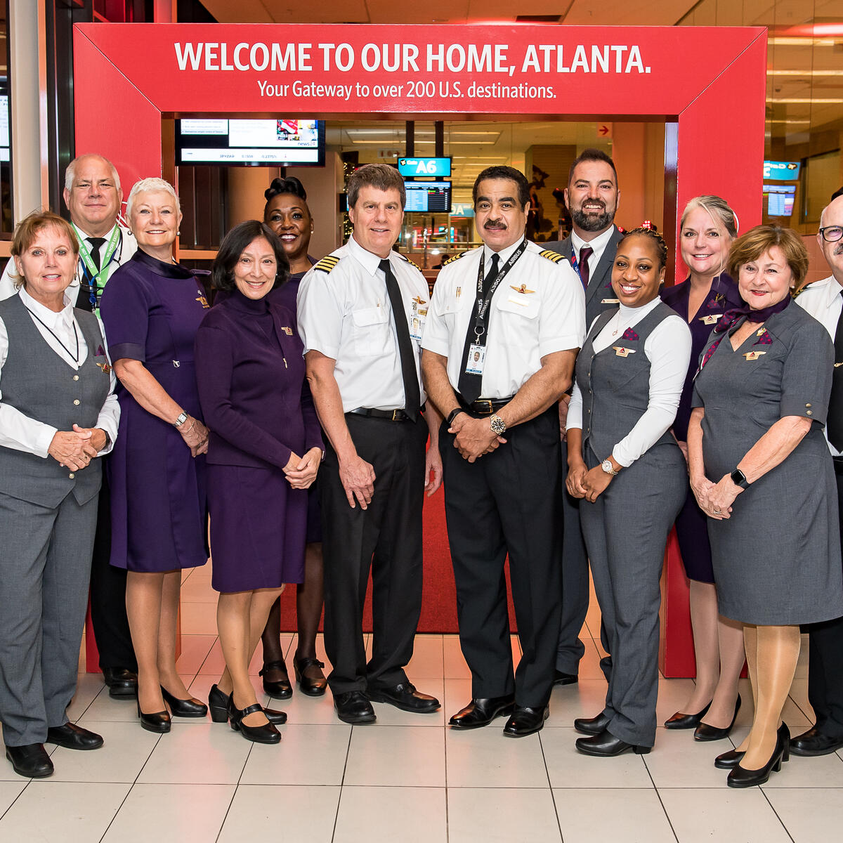 A Delta Flight Crew including pilots and flight attendants celebrate the airline's first flight from Cape Town, South Africa to Atlanta, Georgia, United States.