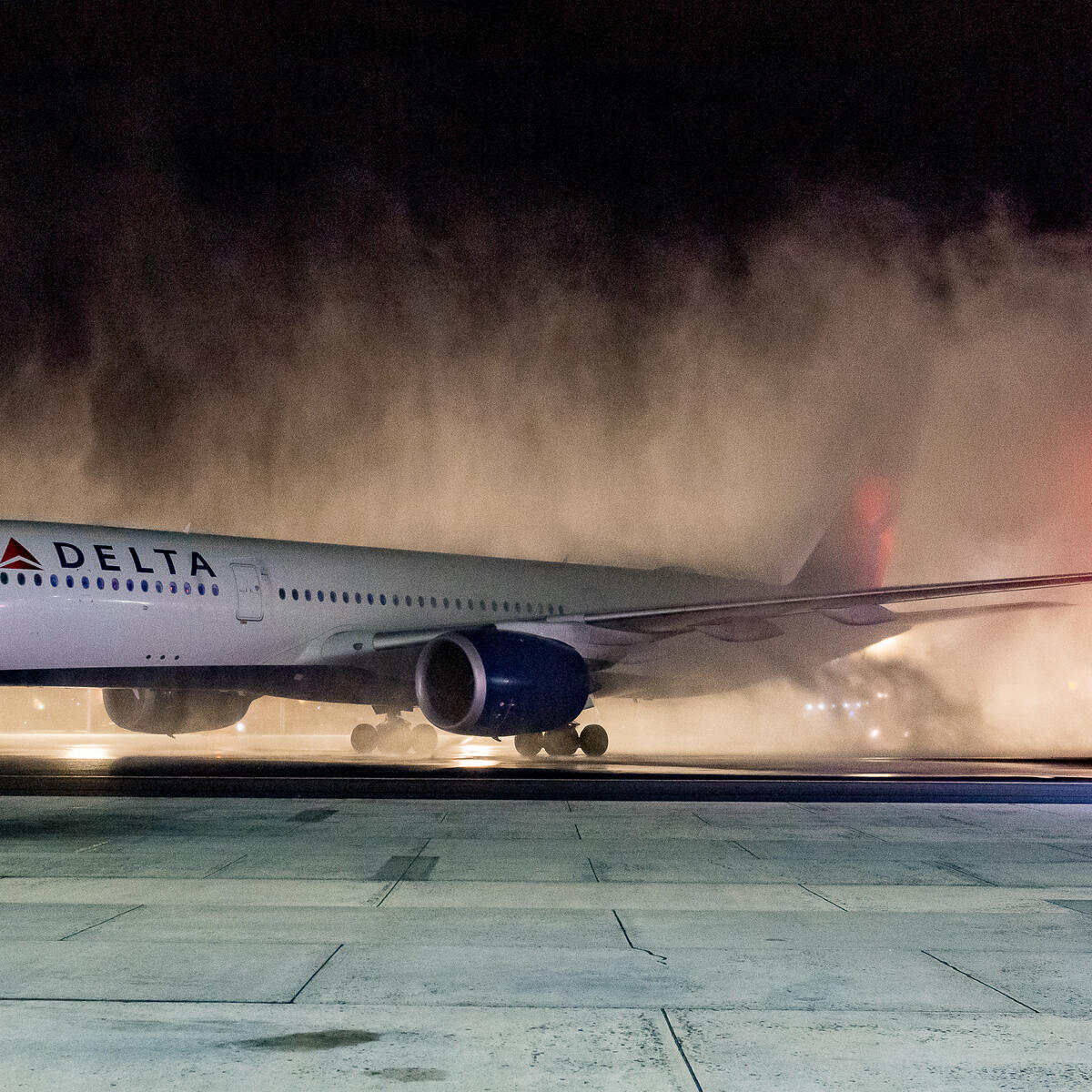 A Delta Air Lines Airbus A350 is welcomed with a water cannon salute upon arrival at Cape Town International Airport (CPT).