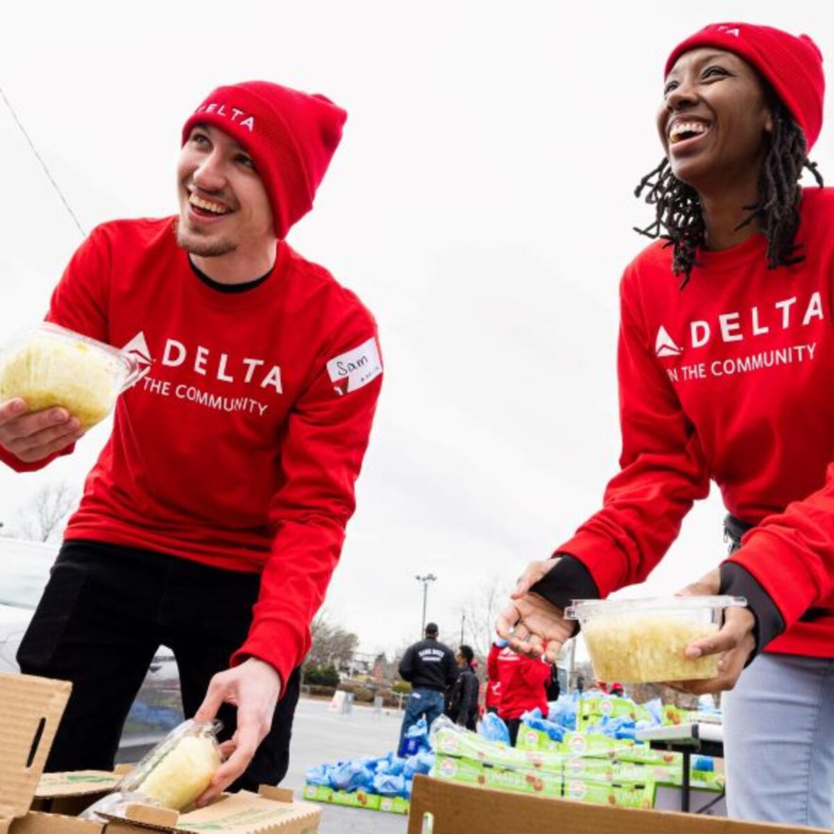 Two Delta employees volunteer at Hosea Helps in Atlanta during the annual "Hosea Helps Festival of Services" event.