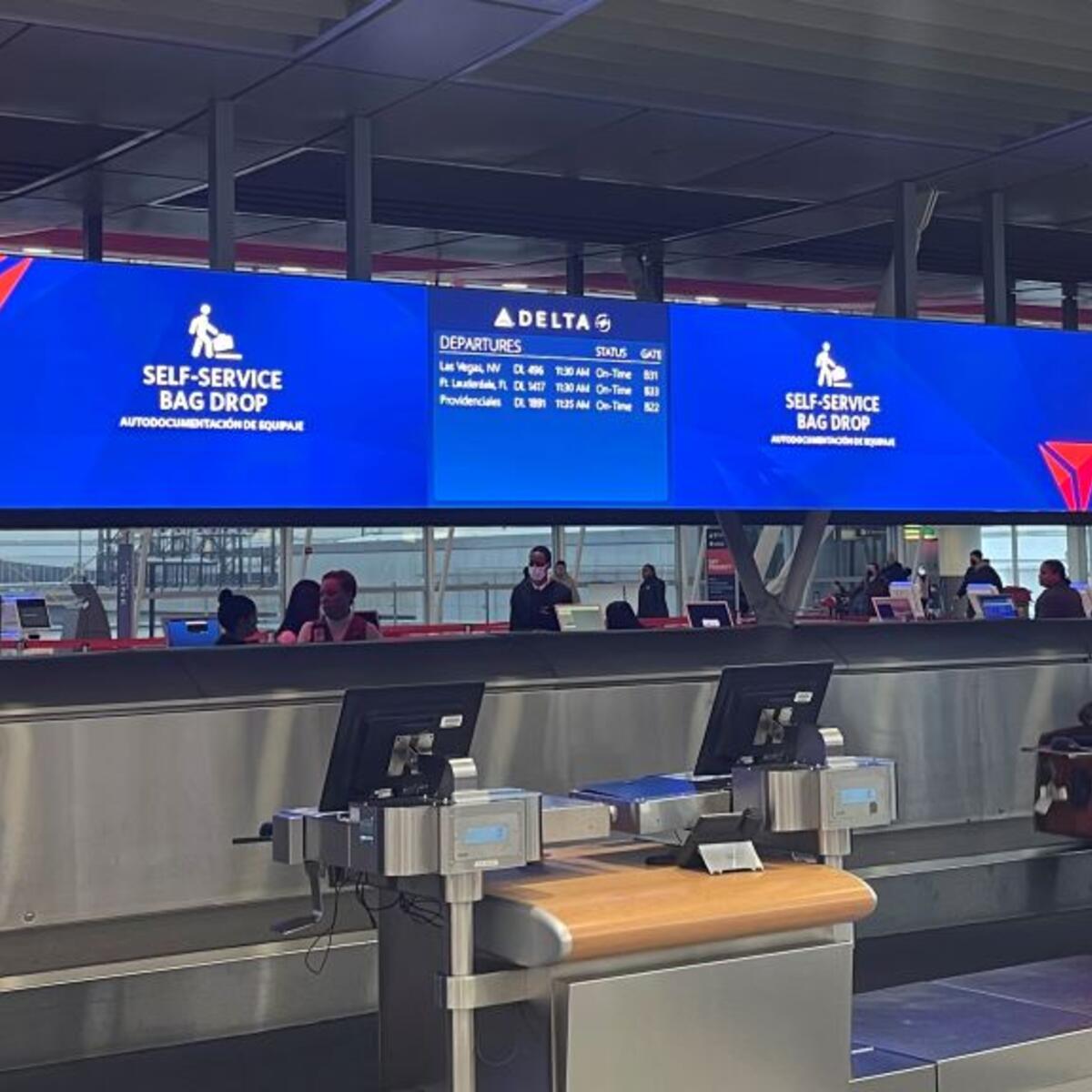 Delta's updated bag drop area at its newly consolidated Terminal 4 in New York City - JFK utilizes the latest technology to improve efficiency during busy travel times.