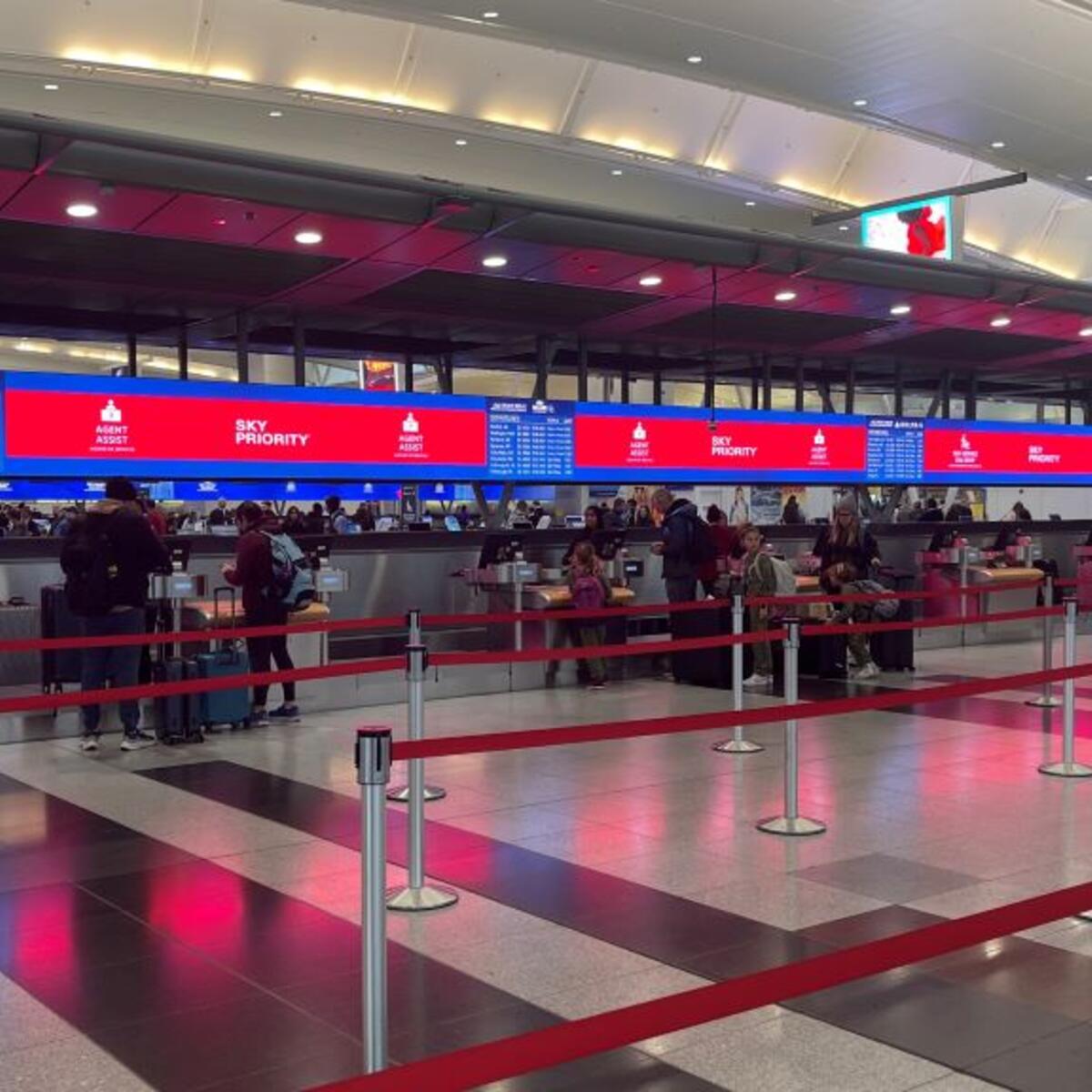 Delta’s signature digital backwall with up-to-date gate information at New York - JFK.