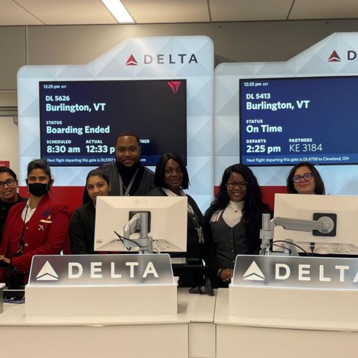 Delta employees stand at a gate in Delta's newly consolidated Terminal 4 at New York City - JFK.