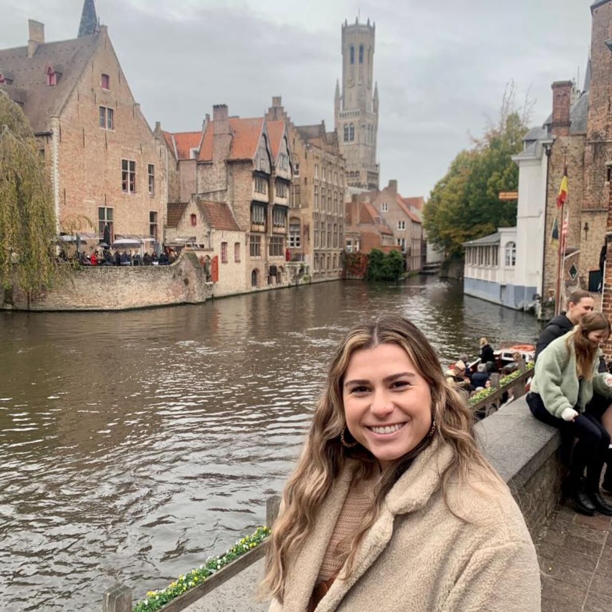 A Delta employee stands on the riverfront in Brussels.