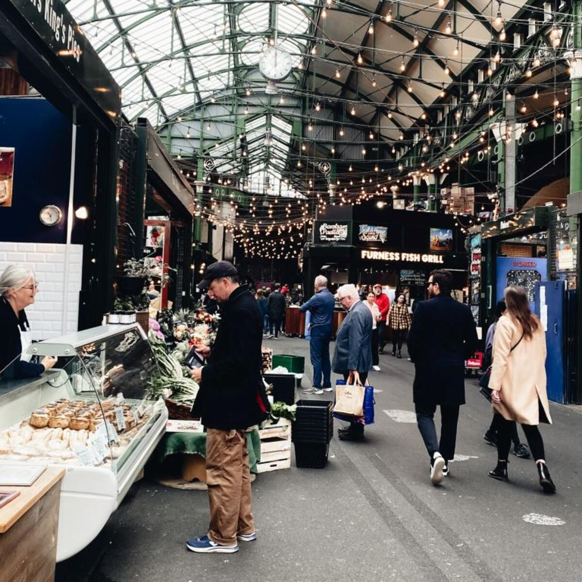 People walking through Borough Market in London