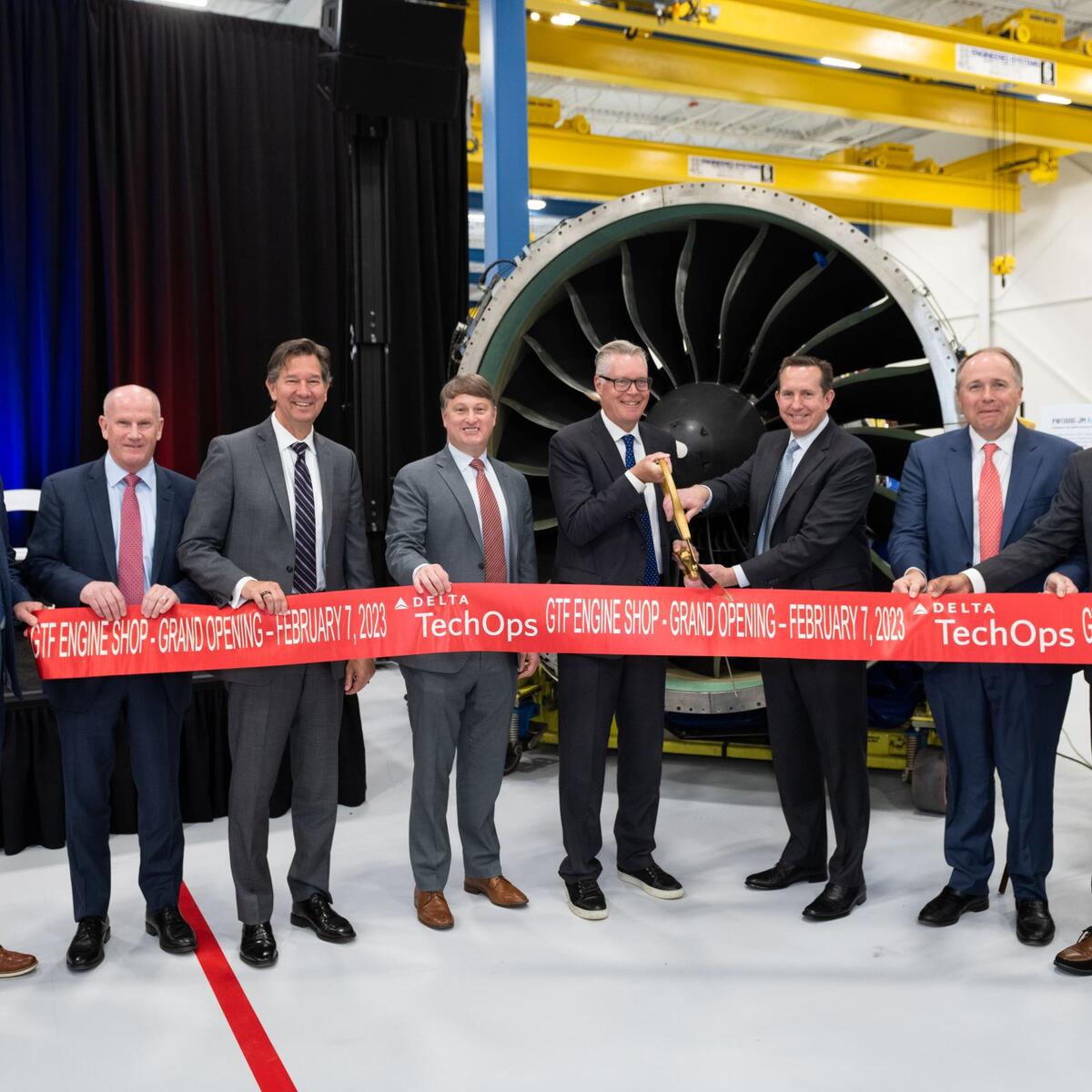 Delta and Pratt & Whitney officials celebrate the grand opening of a new repair facility.