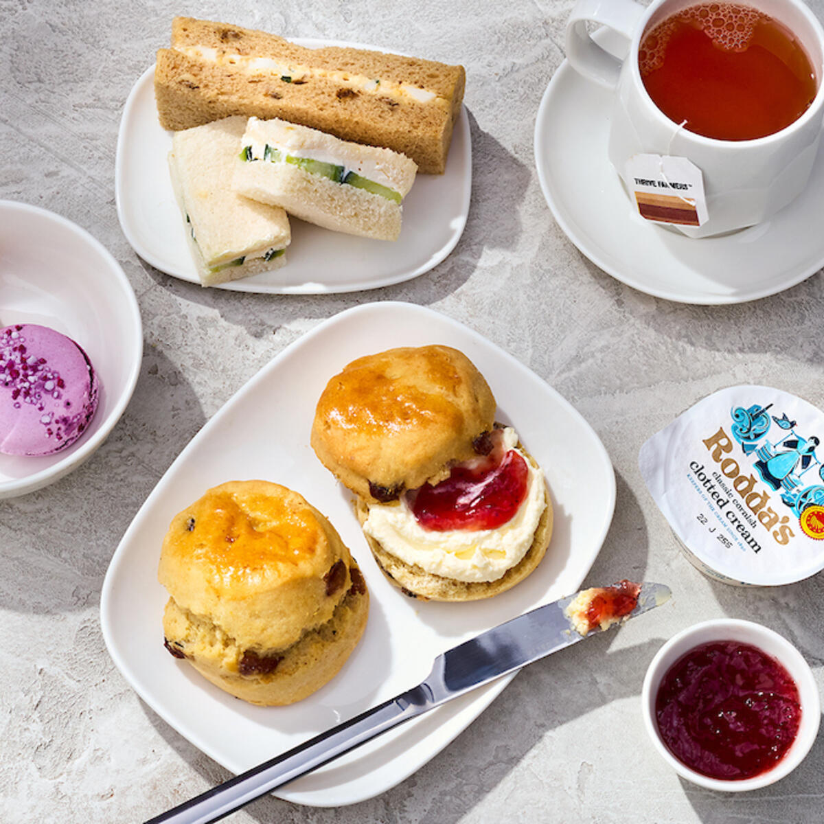 An afternoon tea pre-arrival menu selection in Delta One features scones, tea sandwiches, mini pastries and more.