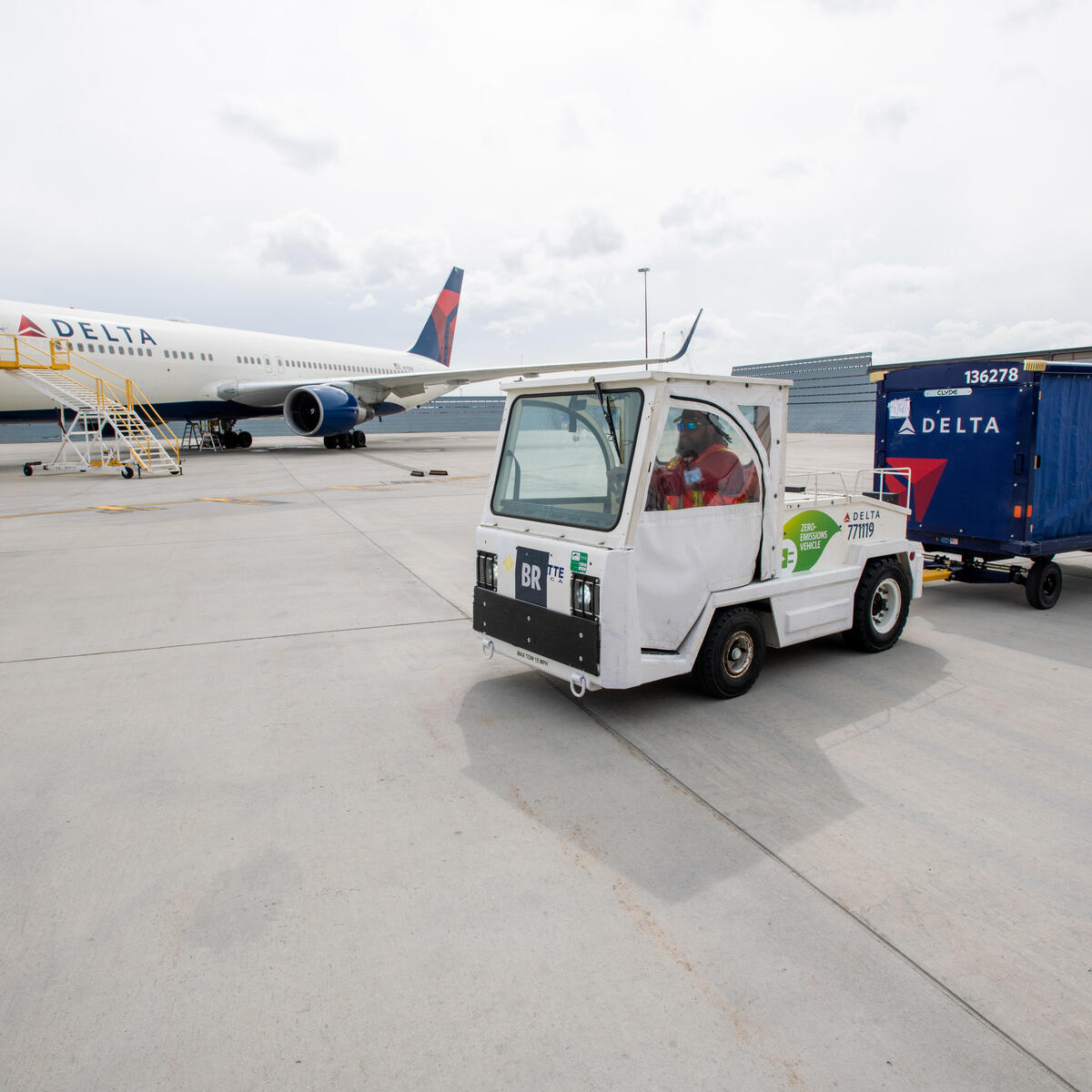 Delta Aircraft Load Agent Thomas Tuikolovatu operates an electric bag tractor at Salt Lake City International Airport (SLC).