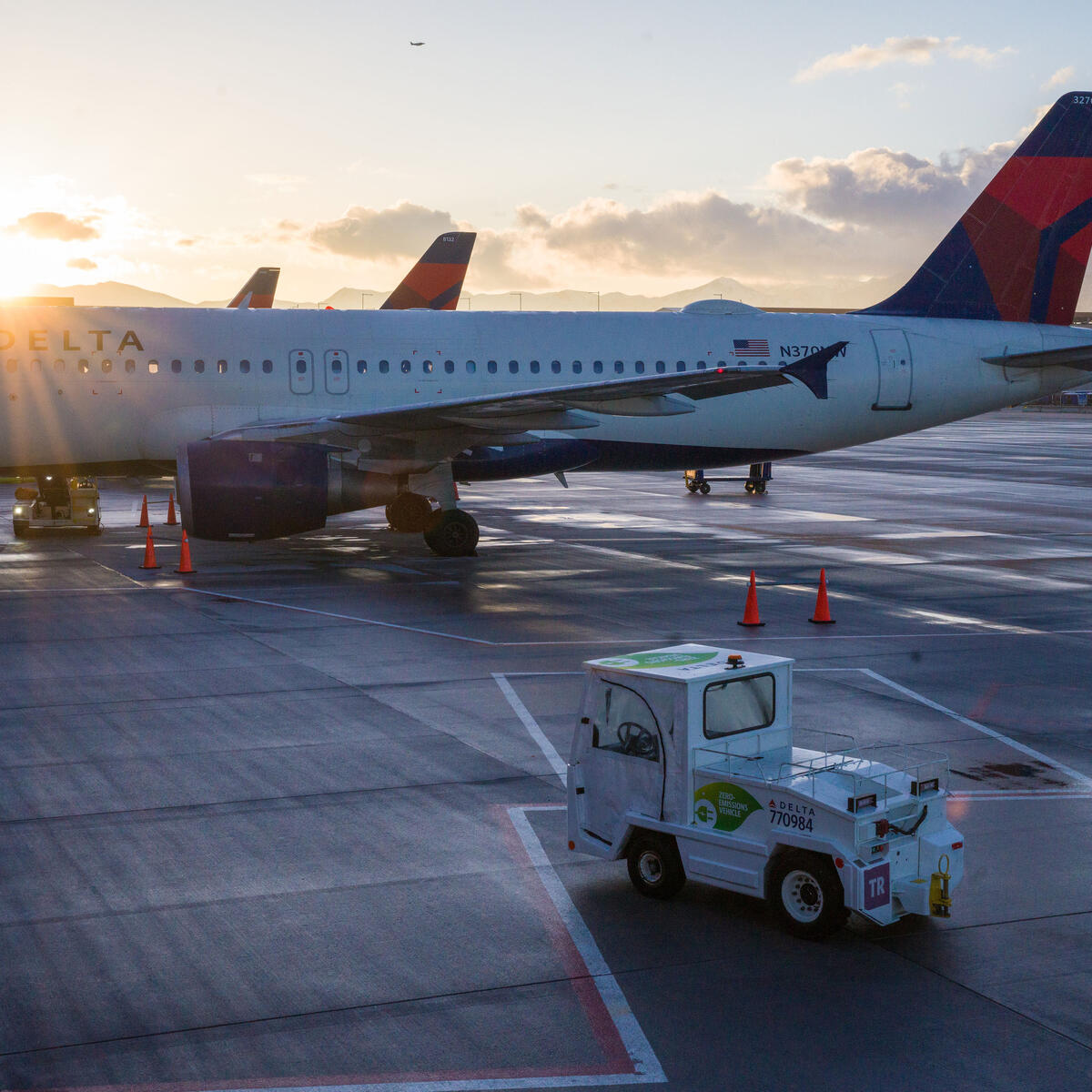 An electric bag tractor with a “zero-emission” vehicle decal is seen on the ramp at Salt Lake City International Airport (SLC).