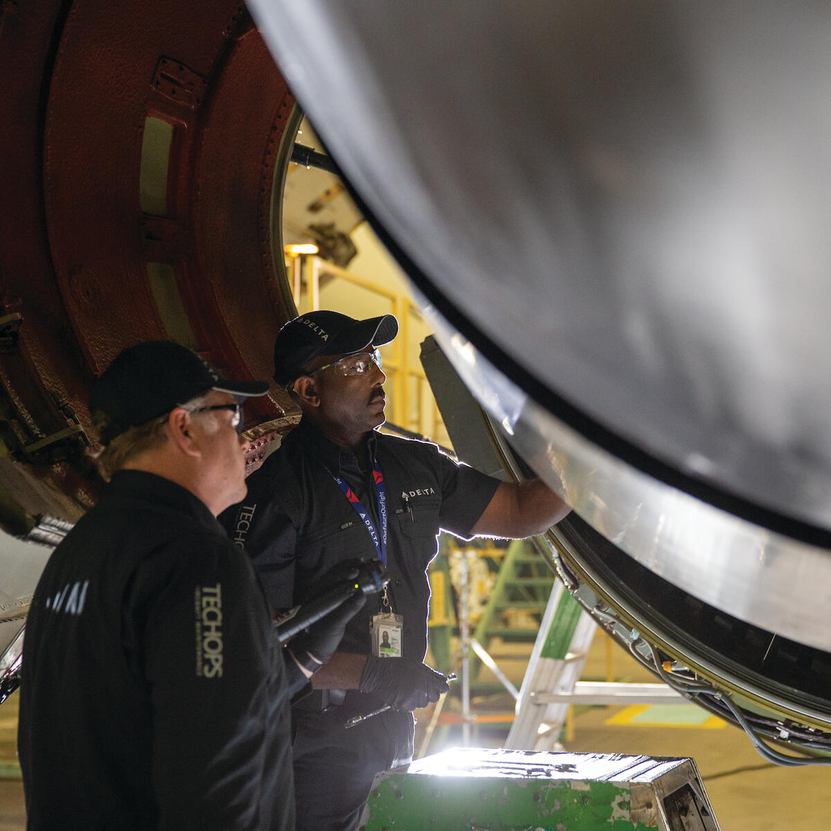 Two Delta TechOps employees are shown working in this 2020 photo.