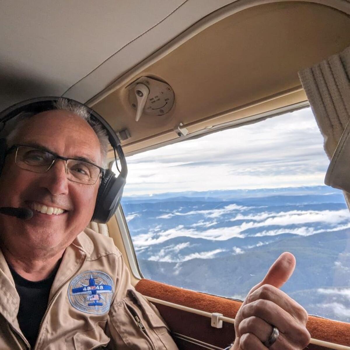 Delta pilot Barry Behnfeldt takes a selfie from the cockpit of his 1980 PA32R Piper Saratoga - the plane used to attempt the Guinness World Record of flying through 48 states in 48 hours.
