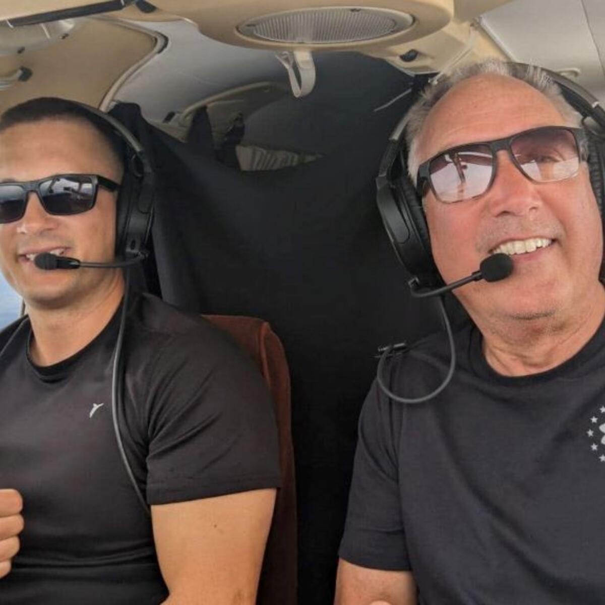 Delta pilots Barry Behnfeldt and Aaron Wilson sit in the cockpit of a six-seat 1980 PA32R Piper Saratoga.