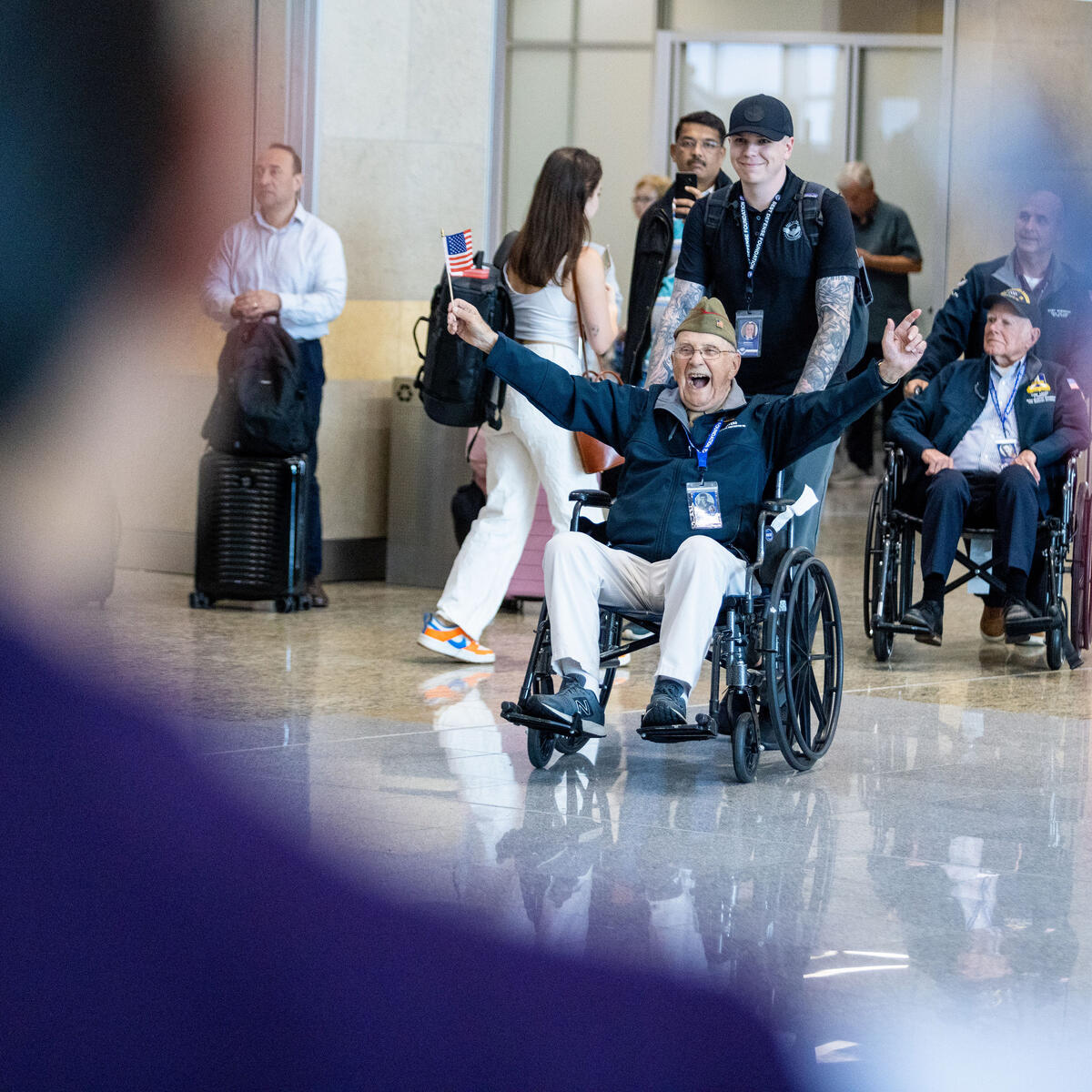 WWII veterans are greeted at the Hartsfield-Jackson Atlanta International Airport before boarding a flight to Normandy, France for the 79th annual commemoration of the 1944 D-Day invasion.  