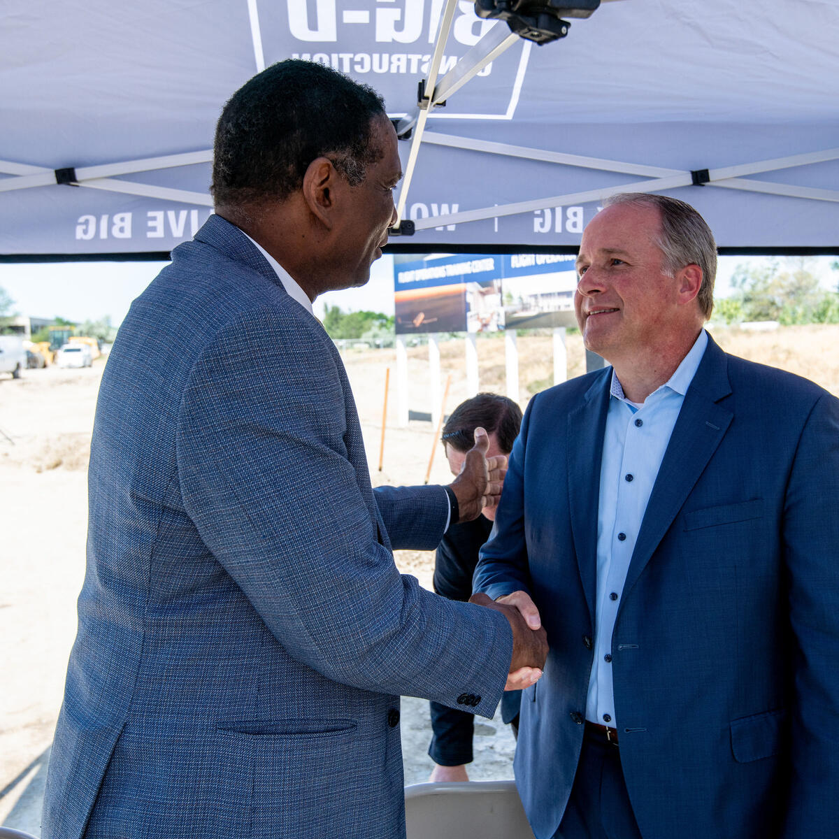 Delta E.V.P. and Chief of Operations John Laughter shakes hands with Utah representative Burgess Owens at the groundbreaking of Delta's new pilot training facility in its key Mountain West hub, Salt Lake City on Thursday, June 29.