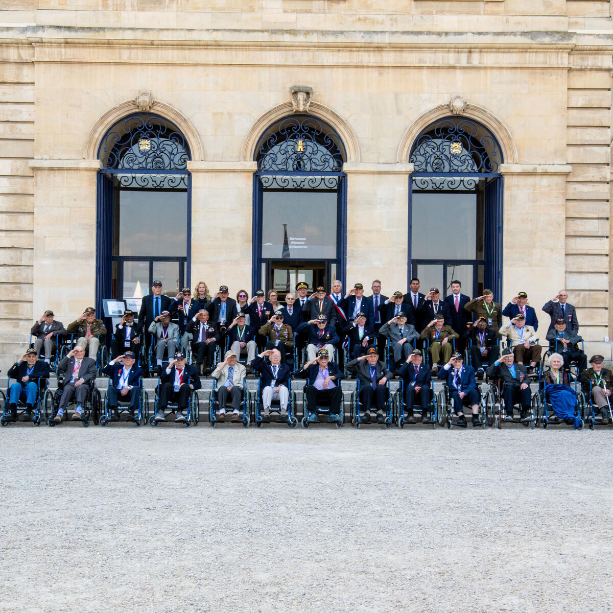 WWII veterans give a salute at our farewell dinner hosted by the mayor of Caen at the Abbaye aux Homes, Caen city hall.