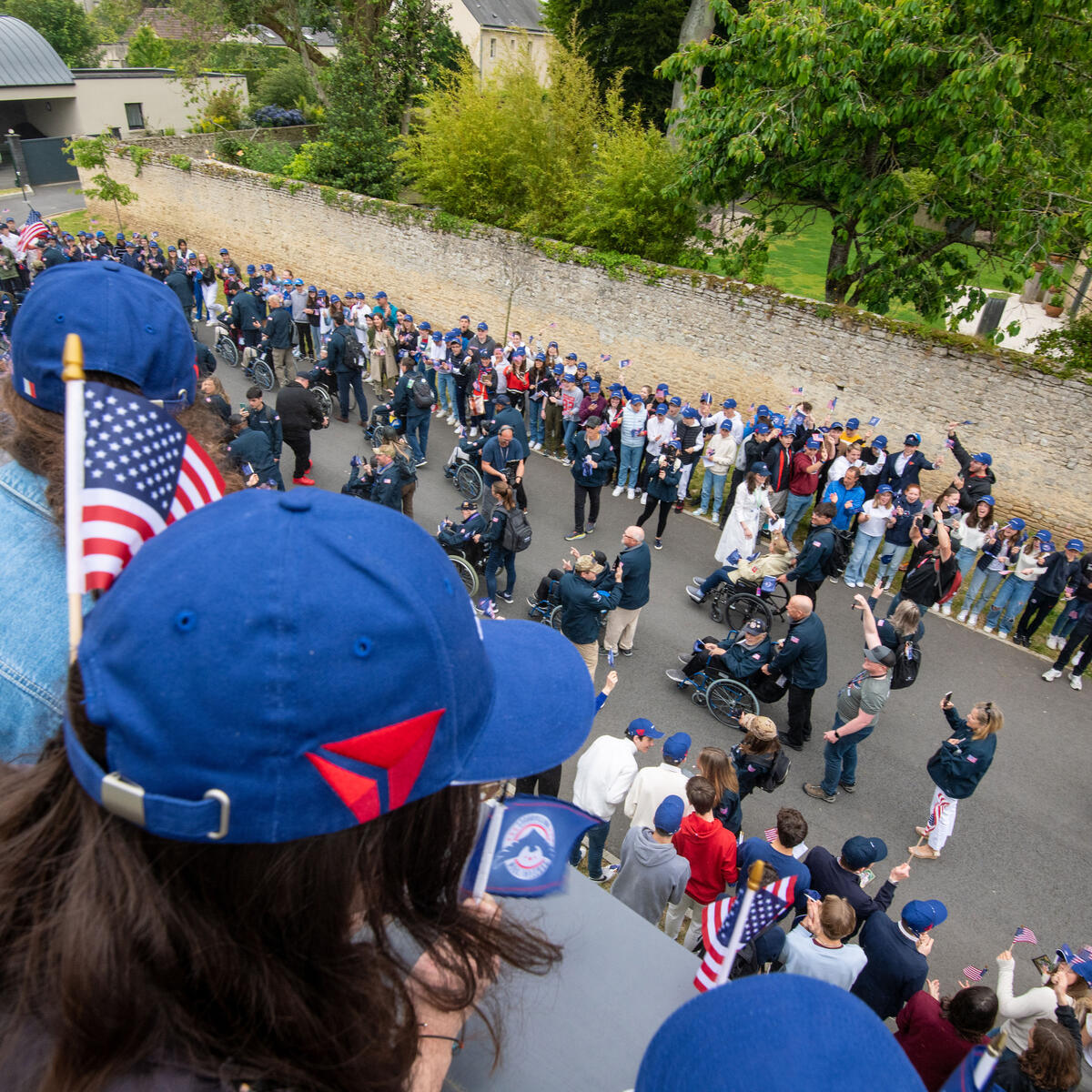 Students in Bayeux welcome the veterans with a parade for their highly anticipated school visit.