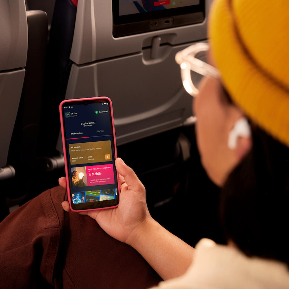 Delta customer browses Delta Sync using Delta's free Wi-Fi.