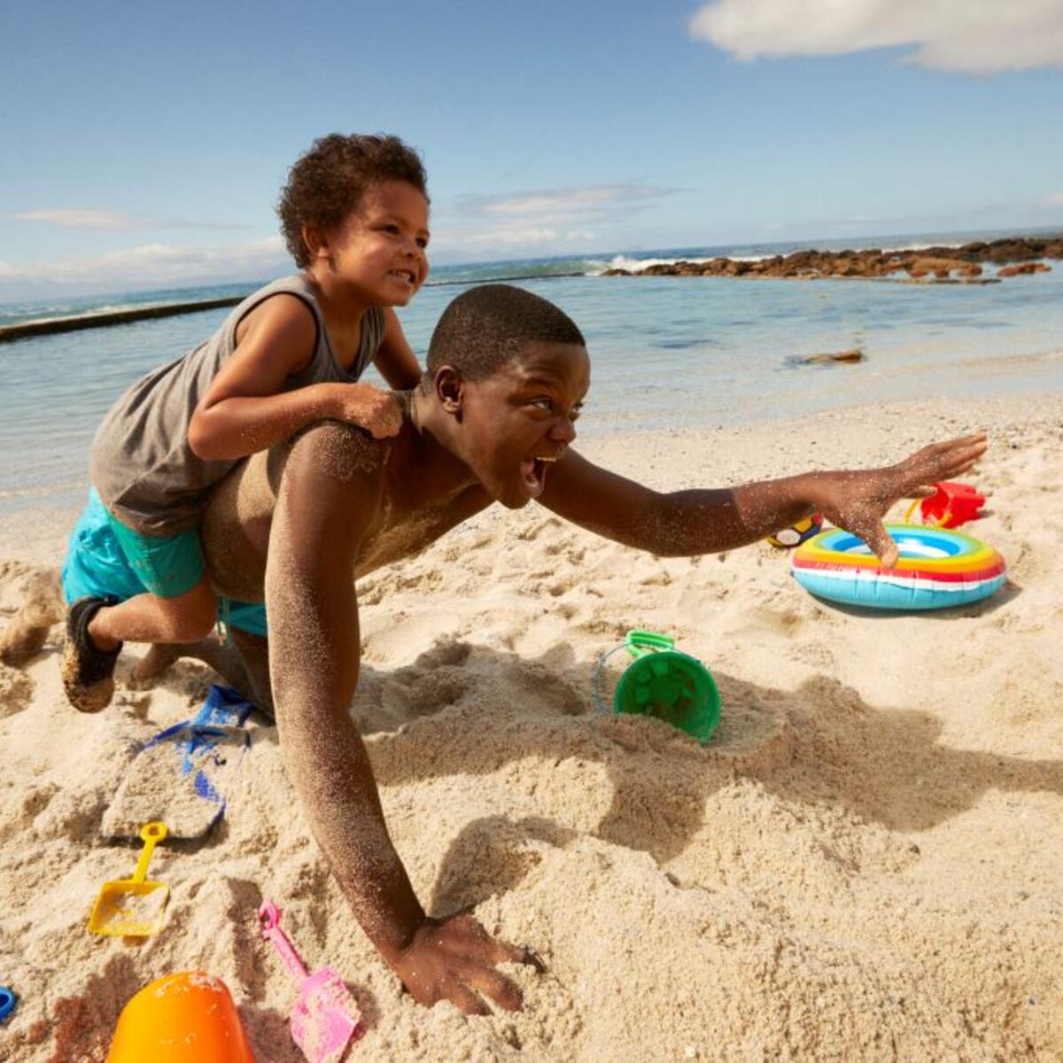 Two kids playing on the beach