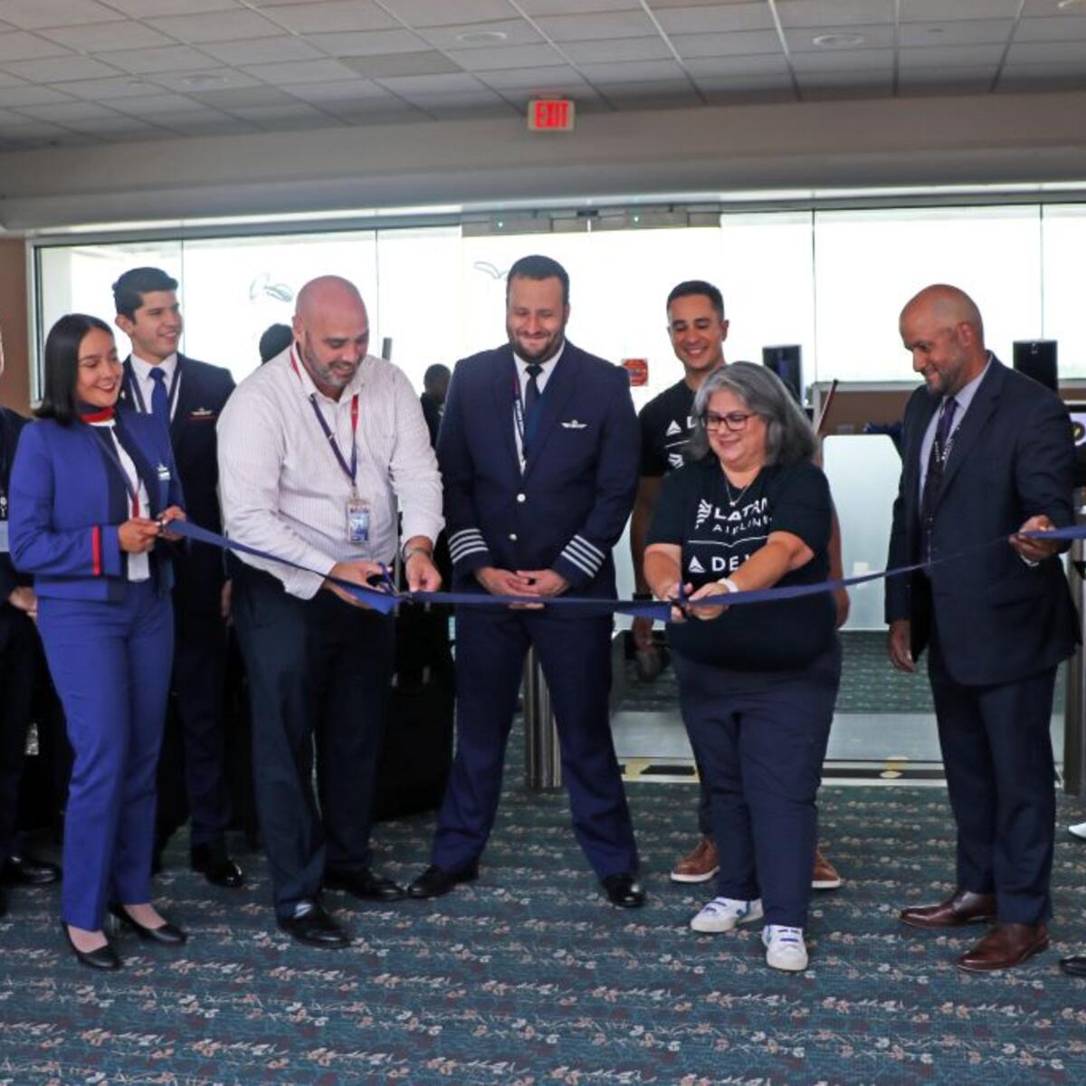 Delta and LATAM people cut a ribbon to signify the start of Bogota-Orlando service.