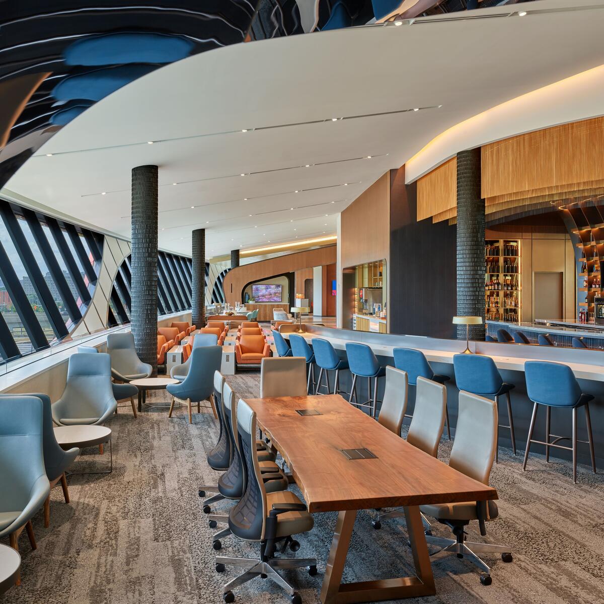 The lounge design takes inspiration from the famous harbor itself, incorporating colors and textures reminiscent of Boston’s nautical history. 