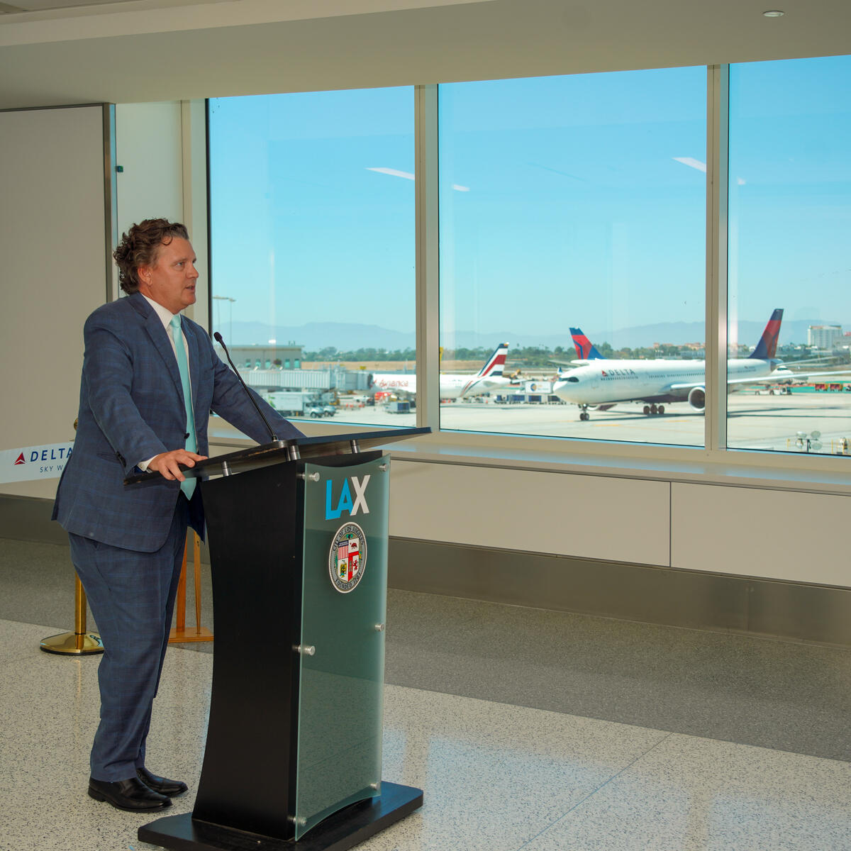 Scott Santoro, Delta's V.P. of Global Sales, speaks at the unveiling of the final major phase of the Delta Sky Way at LAX project.
