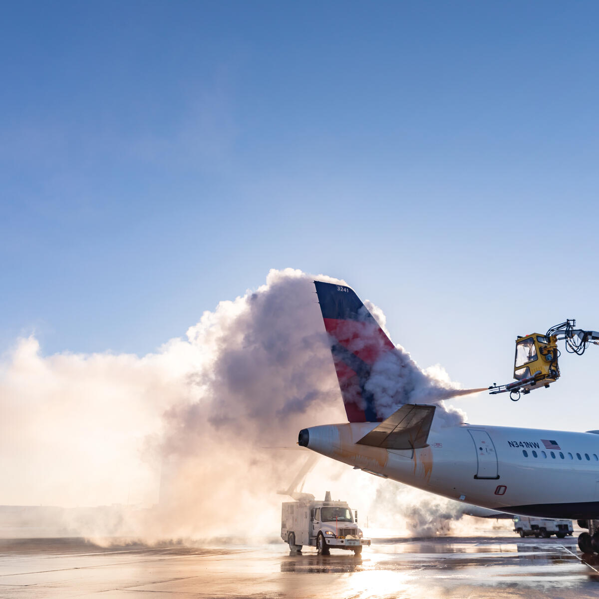 Deicing the tail of an Airbus A320 at Minneapolis-Saint Paul International Airport.