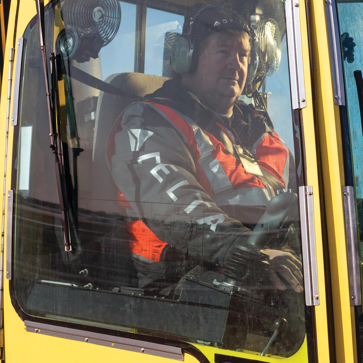 Ramp Agent Bruce Torseth prepares to de-ice aircraft at Minneapolis-St. Paul International Airport.
