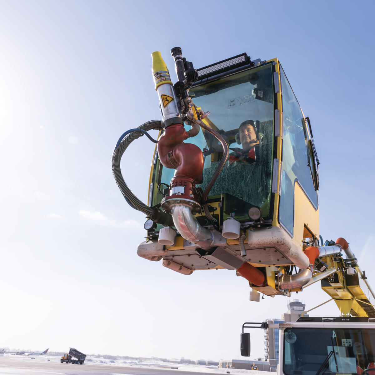 Ramp Agent Bruce Torseth prepares to de-ice aircraft at Minneapolis-St. Paul International Airport.