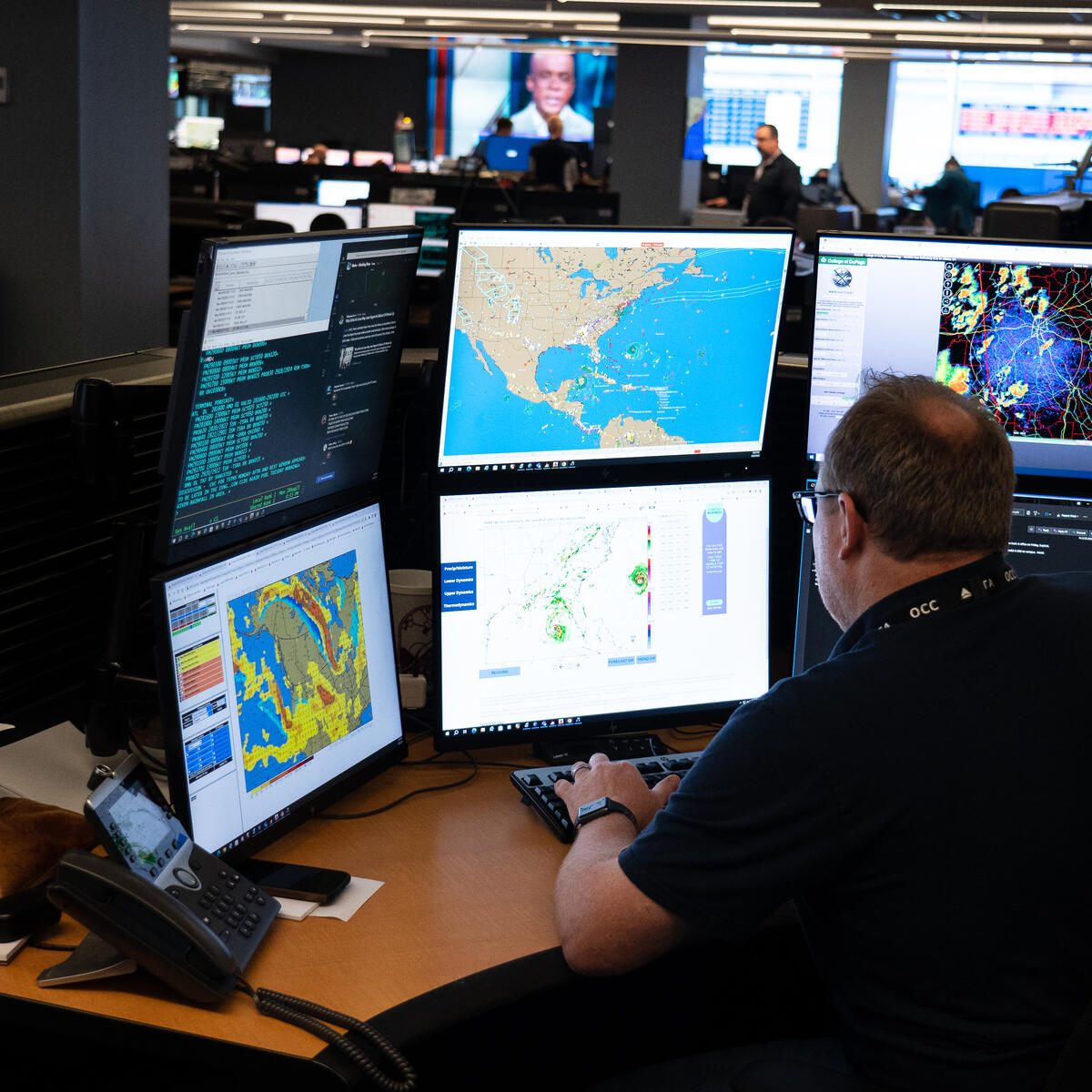 Warren Weston, a member of Delta's in-house meteorology team, sits as his desk in the Operations and Customer Center in Atlanta.