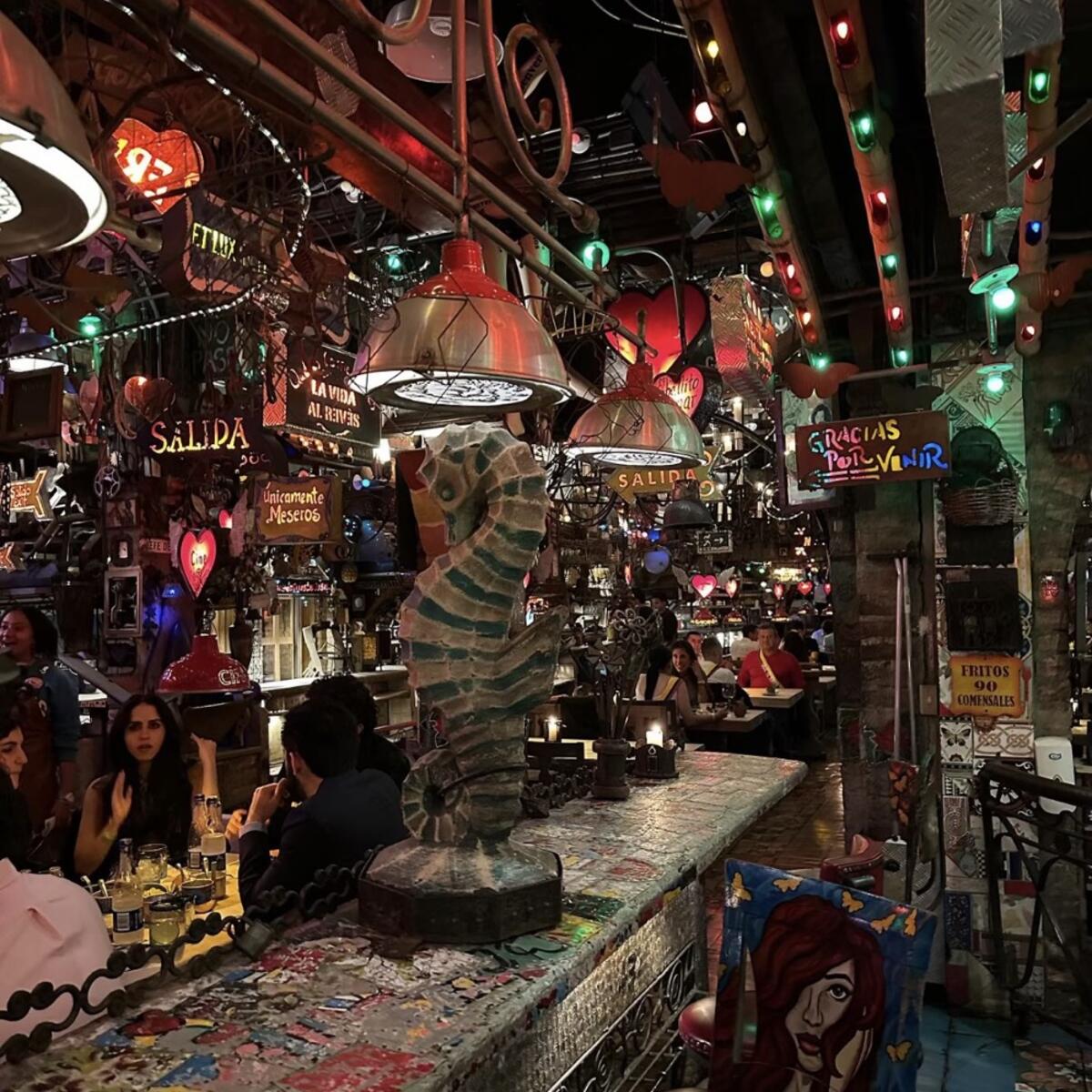 The inside of Andres Carne de Res in Bogota, Colombia, a steakhouse that serves Colombian classics and is a lively club at night