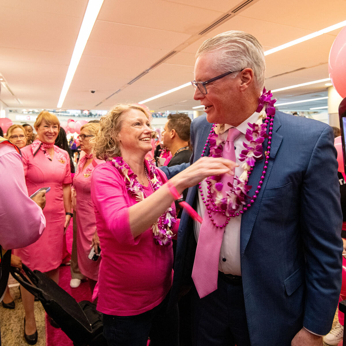Ed Bastian joins the breast cancer survivors during the preflight celebration for the Breast Cancer One charter flight.