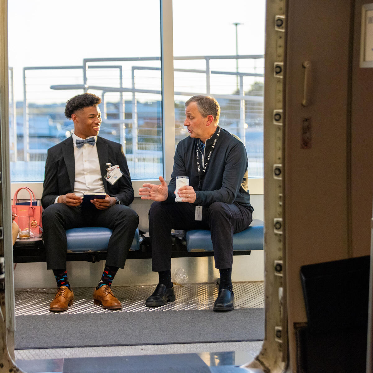 An attendee of Delta's "From the Yard to Delta Boulevard experience sits down to talk with a Delta employee about the airline's culture.