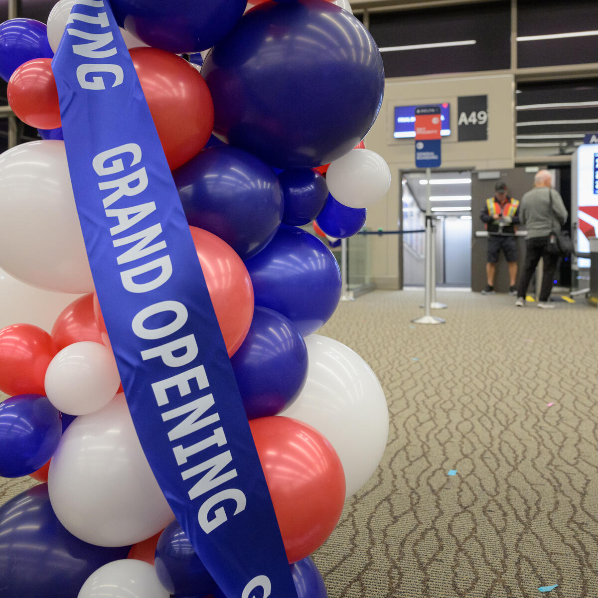 Balloons and a grand opening ribbon decorate Delta's new Concourse A expansion at Salt Lake City International Airport.